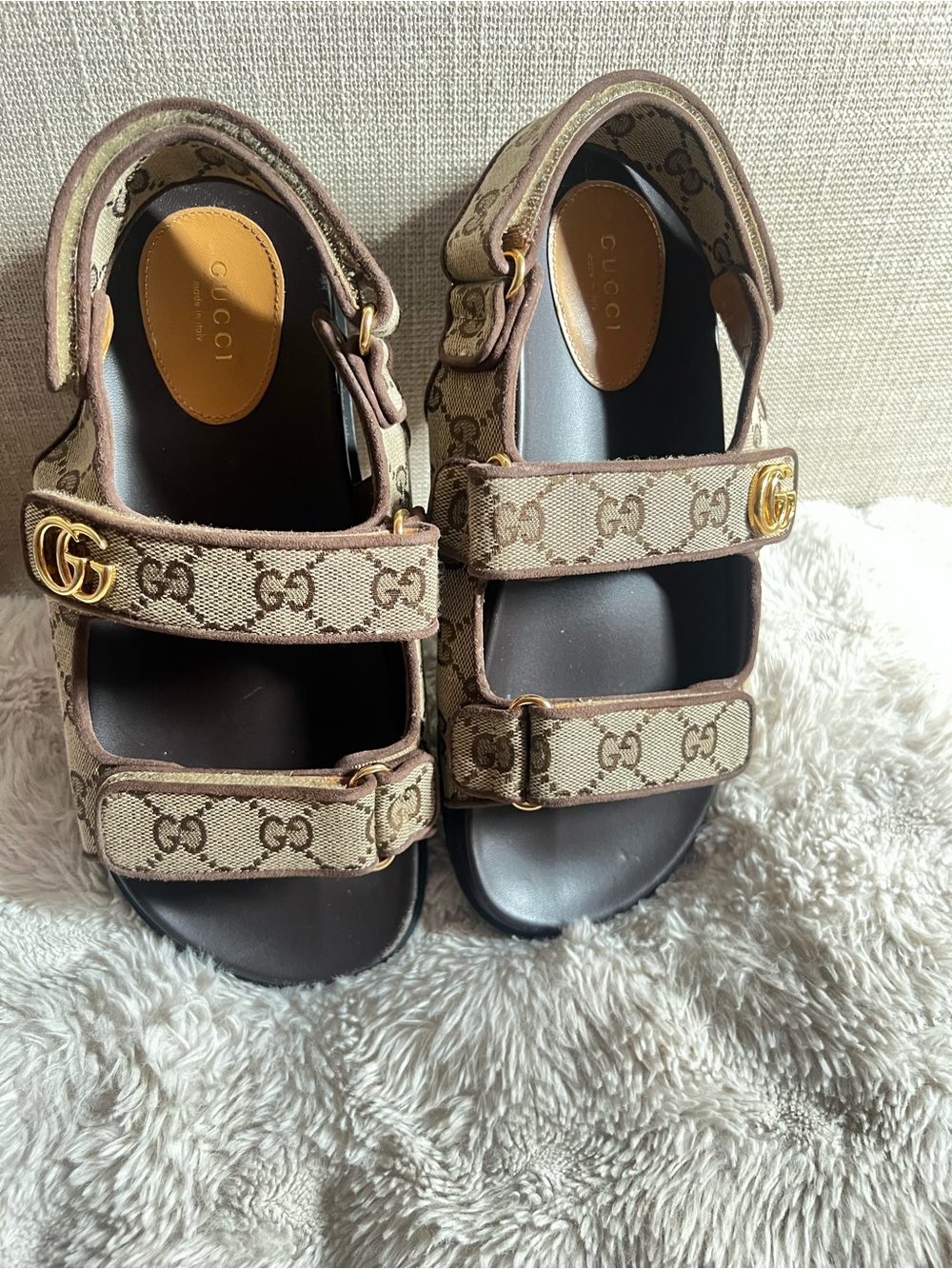Gucci women’s Brown GG Canvas Double-Strap Sandals with Gold Logo